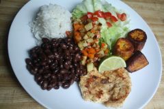 a set meal that usually includes some combination of rice, black bean,s plantain, cabbage, salad, and meat
