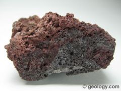 dark-colored with abundant round bubble-like cavities known as vesicles. It ranges in color from black or dark gray to deep reddish brown. 

Many people believe that small pieces of it look like the ash produced in a coal furnace. The thick wall...