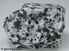 coarse-grained, intrusive rock 
composed primarily of plagioclase feldspar, amphibole, and pyroxine minerals with small amounts of biotite mica. It typically contains very little quartz. 

abundant white and dark minerals - a “salt and pepper...