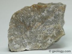 Harder than glass, non-foliated  rock that is produced by the metamorphism of sandstone. It is composed primarily of quartz.