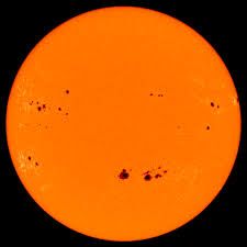 An area of the surface of the sun that appears darker than other areas.
