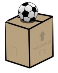 The ball is ON the box.