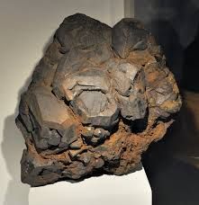 Class: Oxides and Hydroxides
System: Hexagonal
Hardness: 5-6
Specific gravity: 4.5-5
Luster: submetallic
Color: Black or dark brown
Fracture: pseudo-rhombohedral fracture
Streak: Black to brownish red
Sometimes weakly magnetic