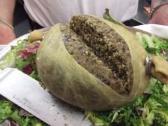 a savoury pudding containing sheep's pluck (heart, liver and lungs)