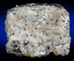 Ca2Si2O6- pyroxene cleavage
- compact, white fibrous aggregates

