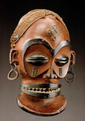 Chihongo Mask
Chokwe
Angola or Congo
19th/20th century
Raffia, cane, cloth/wood, metal, raffia

Chokwe masks were not always made with wood. The dance associated with them involved very rapid hip movements.