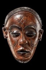 Pwo Mask
Chokwe
Angola or Congo
19th/20th century
Wood, patina, fiber, metal, cane sticks

Whereas the Chihongo masks are royal and represent males, the Pwo masks may be owned by commoners and represent females. Although, they are danced only by ...