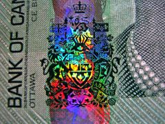 Appears to be 3D

You see it on cash all the time!

Composed of layers of images(which gives it the 3D effect)