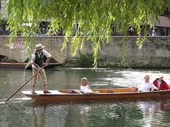 a long, narrow, flat-bottomed boat, square at both ends and propelled with a long pole, used on inland waters chiefly for recreation