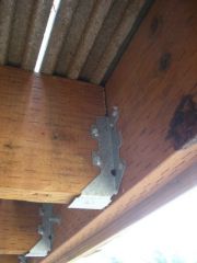 A metal angle or strap used to fix a joist to a beam or girder.
 
 