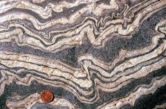 I. Ptygmatic: Folds are chaotic, random and disconnected. Typical of sedimentary slump folding, migmatites and decollement detachment zones.