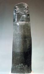 #19 


The Code of Hammurabi


Babylon, moder Iraq


Susian


1,792 - 1,750 B.C.E.


_______________________


Content: This is a basalt stone stella carved with written inscriptions and a top carving of Hammurabi in the presence of a...