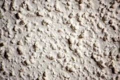 Acoustic "popcorn" ceiling, also known as a “cottage cheese” ceiling, is a spongy material applied to finished drywall by a compressed‐air sprayer. Like acoustical tile, popcorn ceilings were installed to form an attractive textured surface,...