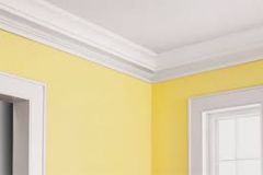 A type of decorative strip used where a wall meets the ceiling, with a curved face and chamfers on the edges; also called cornice.