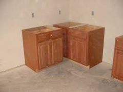 Cabinetry used on the floor to provide counter top support and typically is 34 ½ inches tall and 24 inches deep.