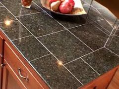 A classic counter top material that lends itself to lots of design styles.
From a ruggedness standpoint, it's a mixed bag. Tile is heat and mar resistant, but it's prone to chipping and cracking. Discolored and deteriorating grout can cause diffic...