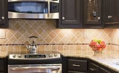 A vertical surface (as of tiles) designed to protect the wall behind a stove or
counter top.