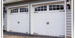 A door, of either the swing‐up or the roll‐up type, which, when open, assumes a horizontal position above the door opening; may be a single leaf or constructed of several leaves; often used as a door on a garage. An overhead garage door is one...