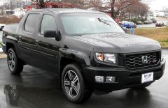 Sport utility truck by Honda. It has a unibody construction and a dual-action tailgate, and FWD unlike most pickup trucks