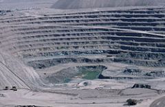 How we use land (urban development, agriculture, mining)

The picture is of a large open mine