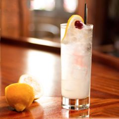 Collins glass (highball)



In shaker glass:
1½ oz gin
¾ oz lemon juice
1 oz simple syrup
Ice fill, shake

Pour over ice and soda fill
Lemon wheel and cherry
