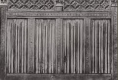an ornamental motif 
resembling folded, linen, carved on 
paneling