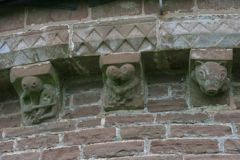 Stone projections in the walls which acted like brackets to support parapets.