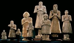 Statues of worshipers from Abu Temple, Tell Asmar Limestone, alabaster, and gypsum, Iraq. ca. 2700-2500 BCE   
They hold small beakers the Sumerians used in religious rites. The men wear belts and fringed skirts. Most have beards and shoulder leng...