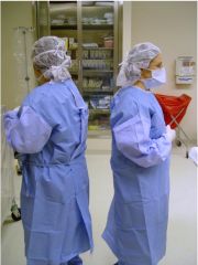 Sterile team faces each other and the sterile field. 
Sterile team passes each other, back-to-back or front-to-front.
Un-sterile persons in the room must always face sterile field.