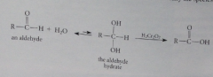 The alcohol is the hydrate formed by addition of H2O to the aldehyde carbonyl group, so some H2O should be present in solution so that aldehyde oxidations with Cr(VI) occur at a reasonable rate