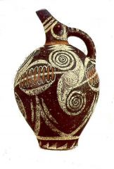 style of painted pottery associated with the palace culture that flourished on Crete during the Middle Minoan period (c. 2100–c. 1550 bc. in which combinations of abstract curvilinear designs and stylized plant and marine motifs are painted in w...