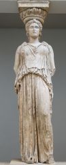 a stone carving of a draped female figure, used as a pillar to support the entablature of a Greek or Greek-style building.